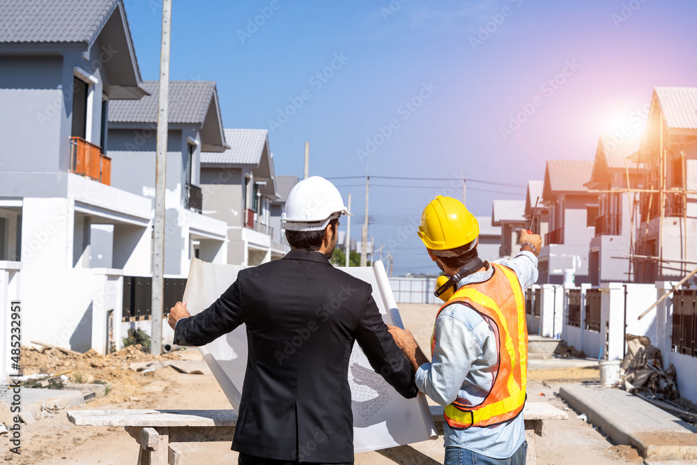 Poster Engineers are discussing data working and blueprint with architectural project at new construction site,Engineering tools and construction concept.