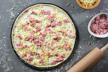 unbaked ham and cheese pizza from above