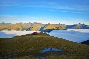 New Zealand, Brewster Hut is a small alpine hut that offers views over Mount Aspiring National...