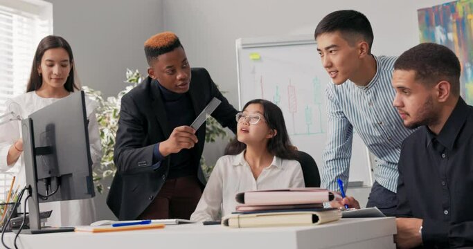 Employees of corporation spend morning working hard on new project, they stare at computer monitor, take notes, collaboration, company atmosphere, successful people, business, brainstorming