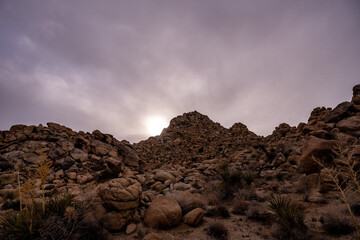 Last Light of the Day Glows Over Boulder Covered Hillside