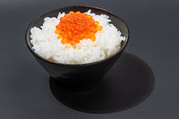 Salmon roes or salmon caviars on white rice, Seafood background