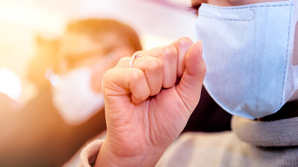 Asian woman passenger coughing over surgical mask to prevent omicron coronavirus