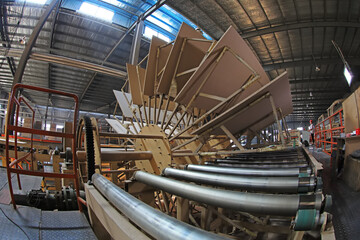 workers work intensively on the wood plate processing production line in the factory, China