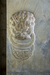 The stone lion carved in rock is on the tomb door of the emperor of the Qing Dynasty in China