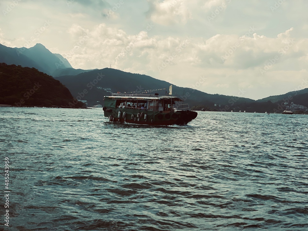 Wall mural boat in the sea