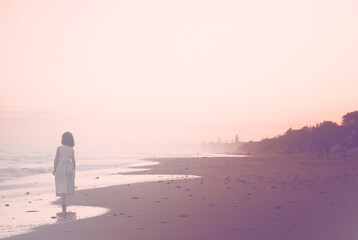 person walking on the beach