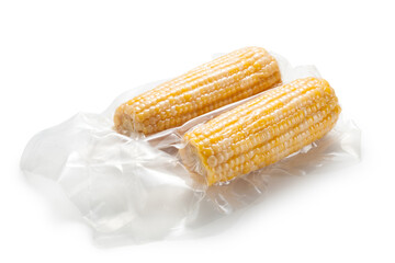 Corn cob in vacuum packaging on white background