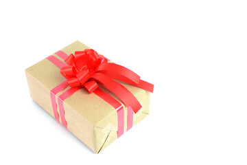 Brown craft gift box with red ribbon bow isolated on white background.