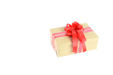 Brown craft gift box with red ribbon bow isolated on white background.