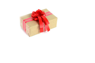 Brown craft gift box with red ribbon bow isolated on white background.