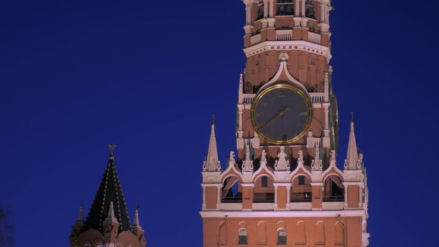 clock on Spasskaya tower of Moscow Kremlin in dusk time, closeup view, historical architecture