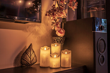 Christmas diwali decoration with fairy lights, candles, books,  Cozy home and holiday concept spa and relax