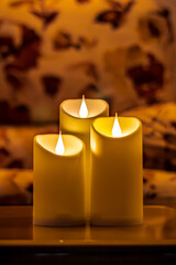 Christmas diwali decoration with fairy lights, candles, books,  Cozy home and holiday concept spa and relax