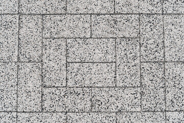 Close up, texture, background. Rectangular paving slabs from a granite crumb.