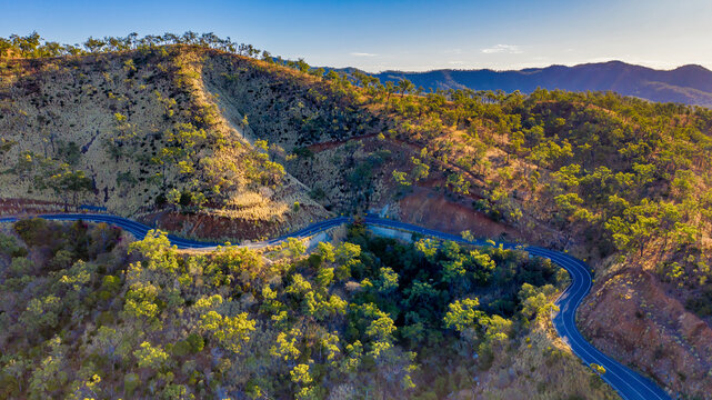 Horizontal shot of road through bushland in Mount Morgan
