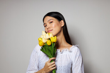 pretty brunette in a white shirt flowers spring posing isolated background unaltered