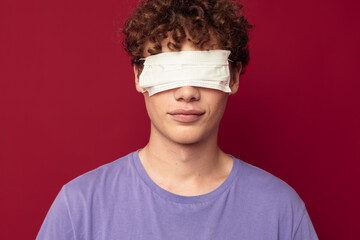young guy medical mask protection posing red background unaltered