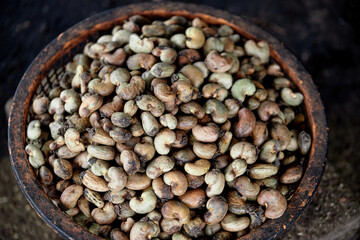 Close-up pile of raw cashew nut in the old stainless basket
