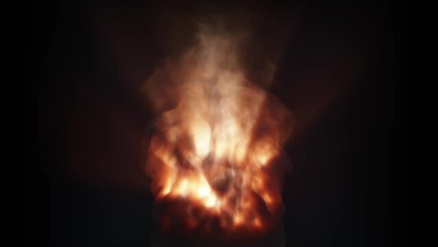 A strong fire lifts up a column of smoke on a black background. Glowing column of smoke.