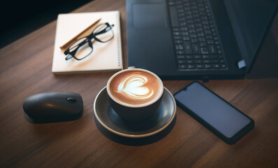 Work from home, desk office with laptop, blank notepad, eye glasses, mobile phone and coffee cup...