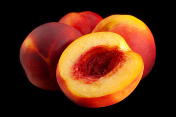 Ripe nectarine fruit on black