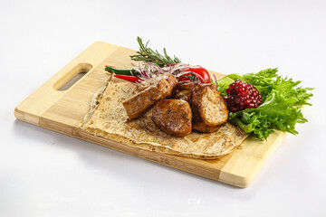 Pork tenderlion kebab over board