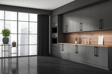 Corner view on dark kitchen room interior with panoramic window