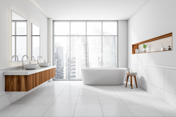 Bright bathroom interior with bathtub, concrete tile floor, panoramic window