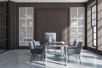 Grey office room interior with workplace, chairs and table, shelf near window