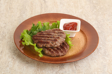 Grilled beef burger cutlet with sauce
