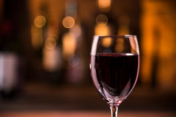 closeup photo of red wine glass on bar counter background