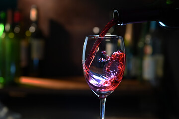 red wine pouring into glass