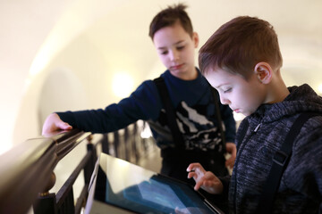 Fototapeta na wymiar Children using touch screen in Entertainment Center