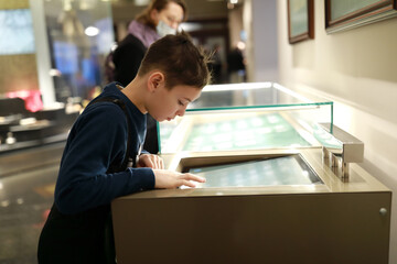 Child plays with touch screen in Entertainment Center