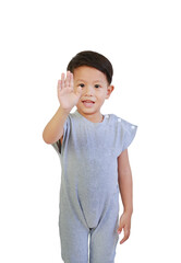 Portrait of Asian little boy show stop sign gesture isolated on white background. Child showing palm of hand, selective focus at his face