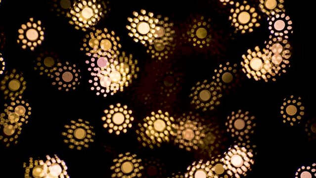 Abstract blurry, low depth of field bokeh light shapes. Vivid, colourful light effects, 4K background video clip with different shapes and dots in various colours. Perfect for Christmas backgrounds