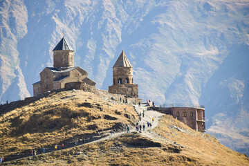 Fototapeta premium Gergeti Trinity Church in autumn in Gerogia Europe