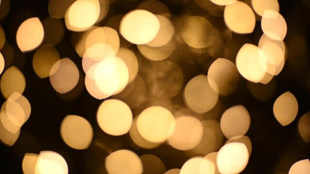 Abstract blurry, low depth of field bokeh light shapes. Vivid, colourful light effects, 4K background video clip with different shapes and dots in various colours. Perfect for Christmas backgrounds