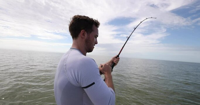 Fishing - man sport fishing shark fishing on boat in Florida