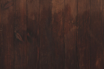 Fototapeta premium Vintage colored wood background texture with knots and nail holes. Old painted wood wall. Brown abstract background. Vintage wooden dark horizontal boards. Front view with copy space