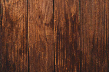Naklejka premium Vintage colored wood background texture with knots and nail holes. Old painted wood wall. Brown abstract background. Vintage wooden dark horizontal boards. Front view with copy space
