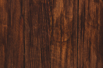 Vintage colored wood background texture with knots and nail holes. Old painted wood wall. Brown abstract background. Vintage wooden dark horizontal boards. Front view with copy space