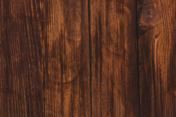 Obraz premium Vintage colored wood background texture with knots and nail holes. Old painted wood wall. Brown abstract background. Vintage wooden dark horizontal boards. Front view with copy space