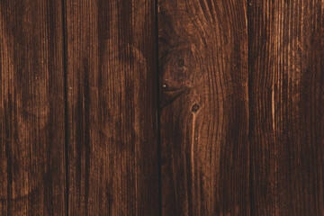 Obraz premium Vintage colored wood background texture with knots and nail holes. Old painted wood wall. Brown abstract background. Vintage wooden dark horizontal boards. Front view with copy space