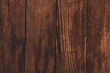 Vintage colored wood background texture with knots and nail holes. Old painted wood wall. Brown abstract background. Vintage wooden dark horizontal boards. Front view with copy space