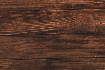 Vintage colored wood background texture with knots and nail holes. Old painted wood wall. Brown abstract background. Vintage wooden dark horizontal boards. Front view with copy space