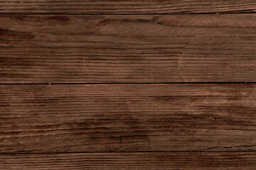 Fototapeta premium Vintage colored wood background texture with knots and nail holes. Old painted wood wall. Brown abstract background. Vintage wooden dark horizontal boards. Front view with copy space