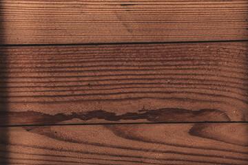 Vintage colored wood background texture with knots and nail holes. Old painted wood wall. Brown abstract background. Vintage wooden dark horizontal boards. Front view with copy space