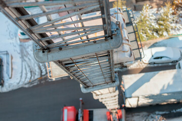 Naklejka premium Lift carrying furniture from home to the ground. Lift transport. Transportation company moving house. Apartment moving. Furniture transportation. 